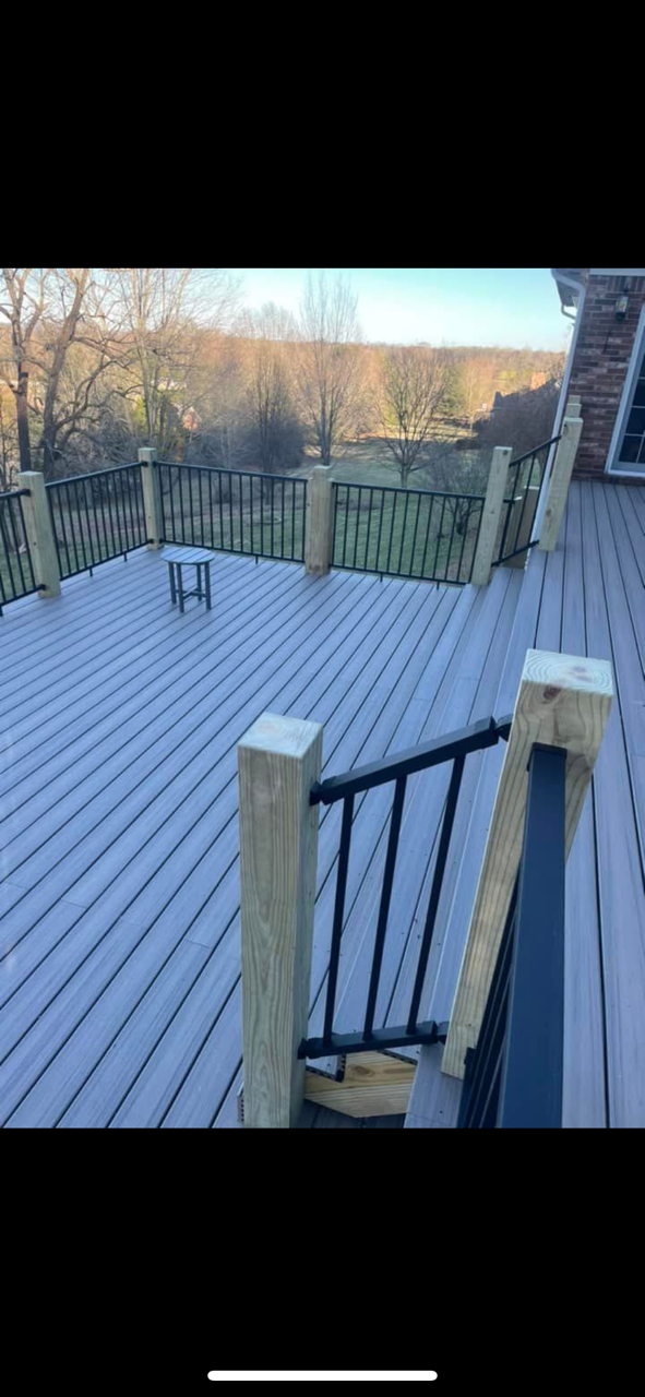 Composite deck with powder coated handrails by Clay Sickel Construction