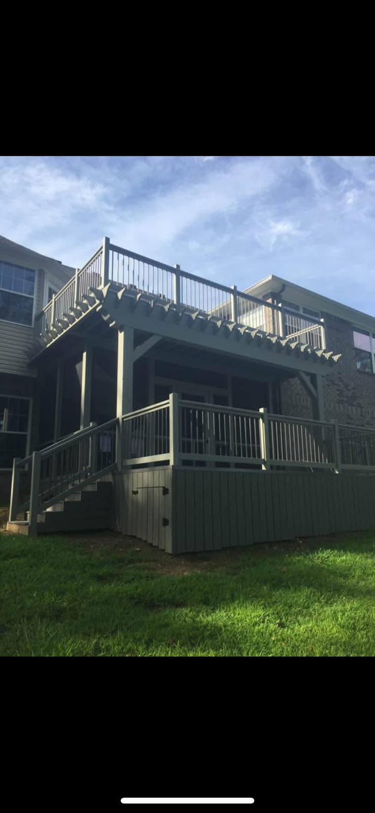 Custom elevated deck with pergola and stairs